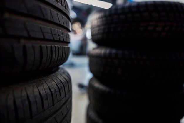 Close up of old and new tires in mechanic39s shop