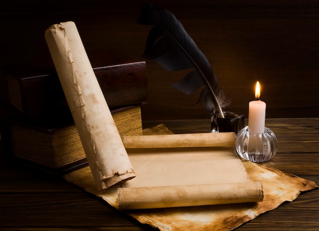 Close up on old papers and books on a wooden table