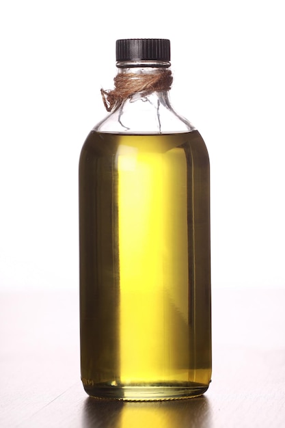 Photo close-up of olive oil against white background