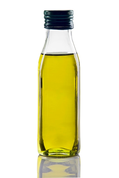 Photo close-up of olive oil in glass bottle against white background