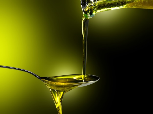 close up of olive oil poured into a spoon