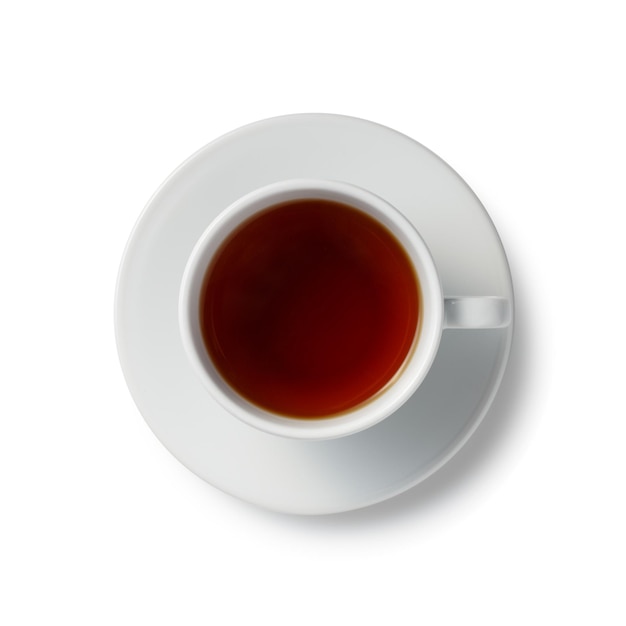 Close up one full white cup of black red tea on saucer isolated on white background elevated top view directly above