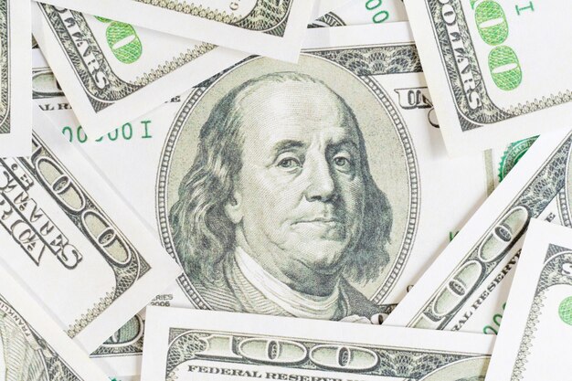 Photo close up one hundred dollar bill background