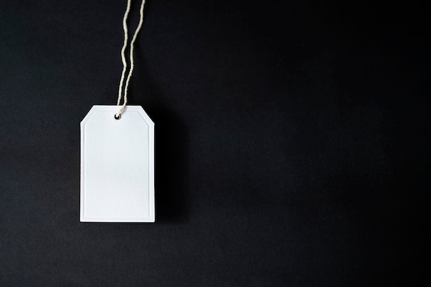 close up of one white label on black background