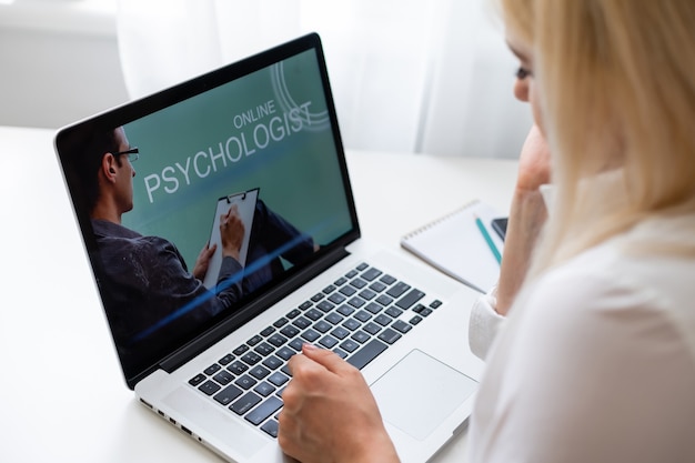 Close up online consultation with doctor on computer, video call consulting with male using laptop, healthcare concept