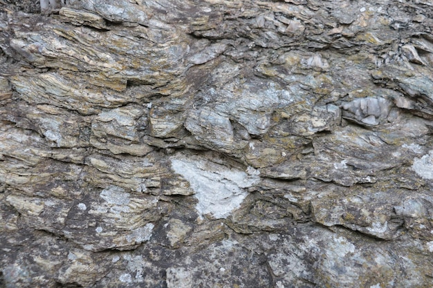 Close-up op de steentextuur van de Achtergrond van de bergrots