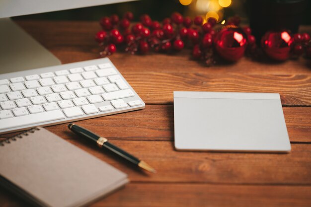 Close up of an open notepad with pen on wooden surface table