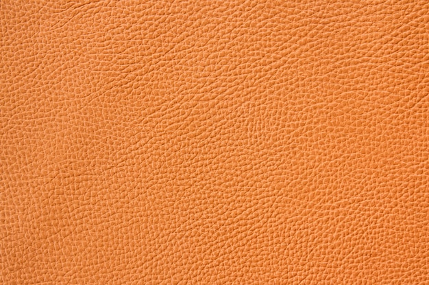 close up of orange or brown leather sheet texture background