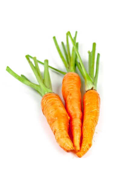 Photo close-up of orange carrots against white background