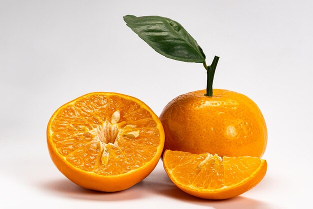 Close-up of orange fruit against white background