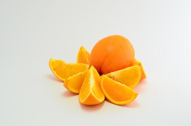 Close-up of orange fruit against white background