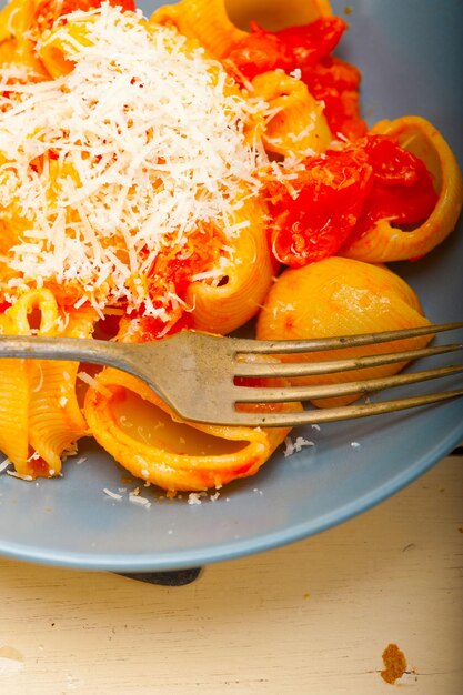 Close-up of orange fruit in plate on table