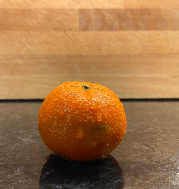 Close-up of orange fruit on table