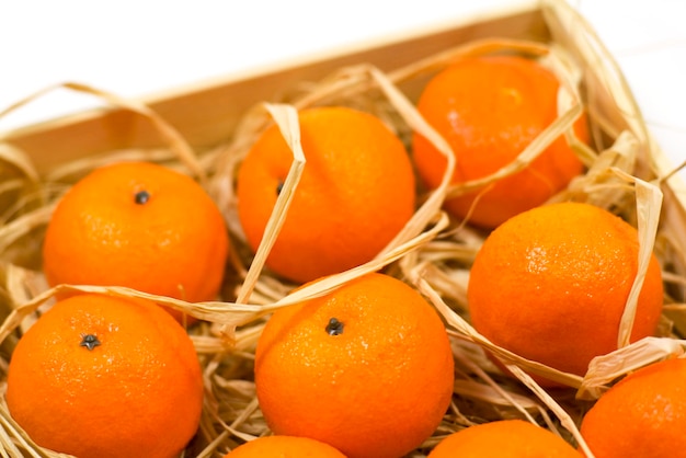 Close-up of orange fruits in basket