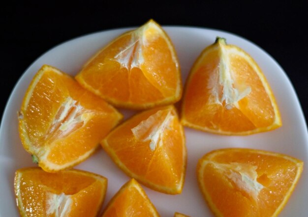 Close-up of orange fruits in plate