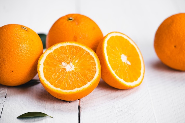 Photo close-up of orange fruits on table