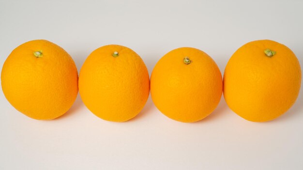 Close-up of orange fruits on white background