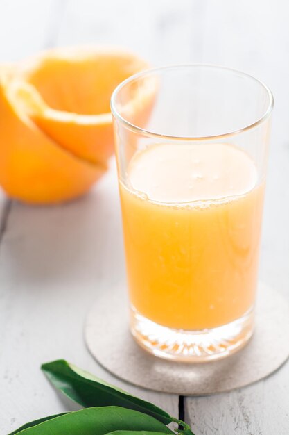 Close-up of orange juice in glass on table