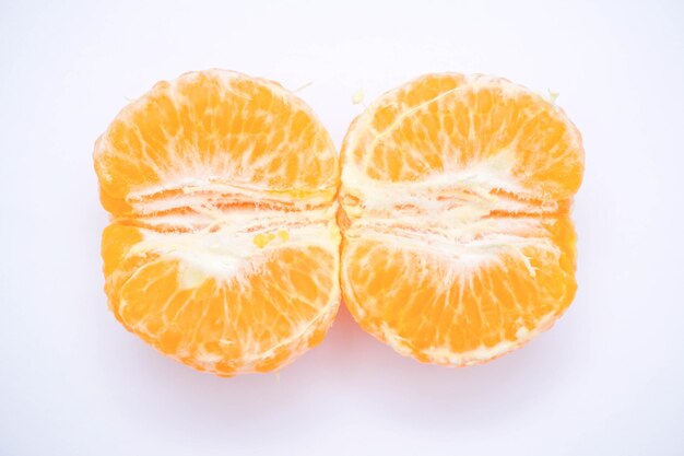 Photo close-up of orange slice against white background