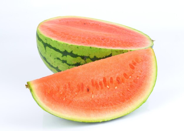 Photo close-up of orange slice against white background