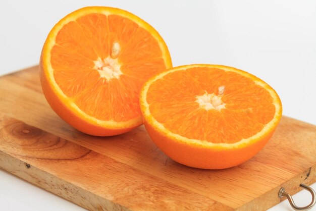 Close-up of orange slice on cutting board