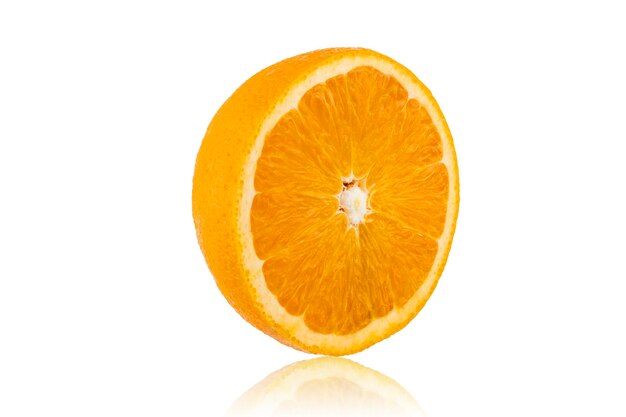 Photo close-up of orange slices over white background