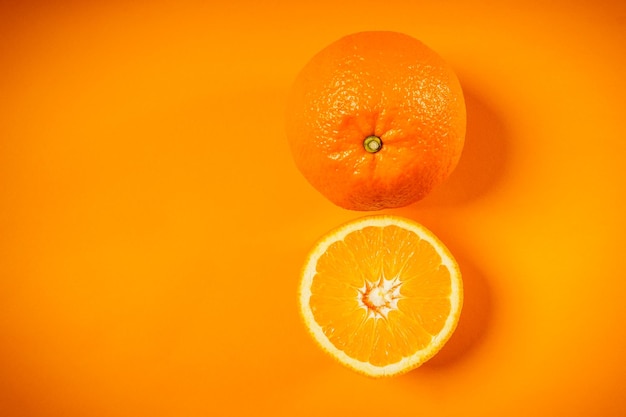 Close-up of oranges over orange background