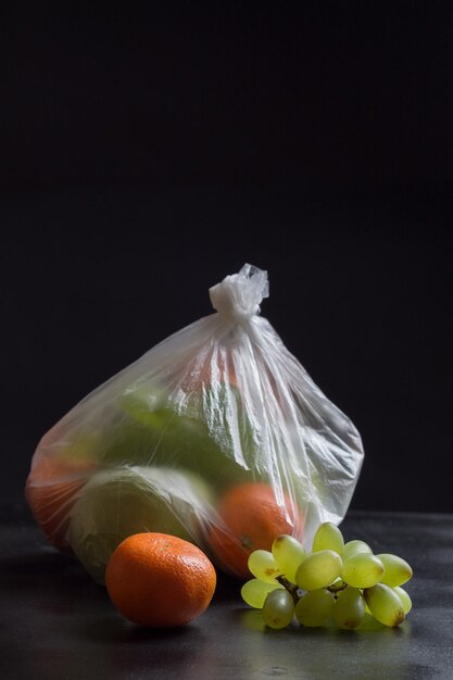 Close-up of oranges on table against black background