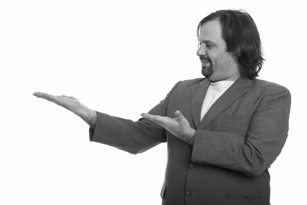 Close up of overweight bearded businessman in suit isolated