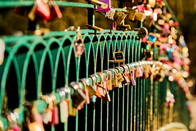 Close-up of padlocks hanging on railing