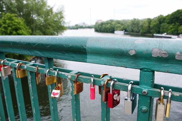 Close-up of padlocks on railing