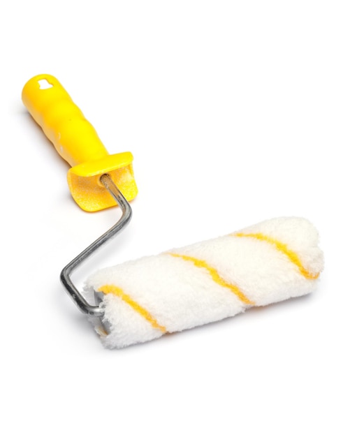 Photo close-up of paint roller on white background