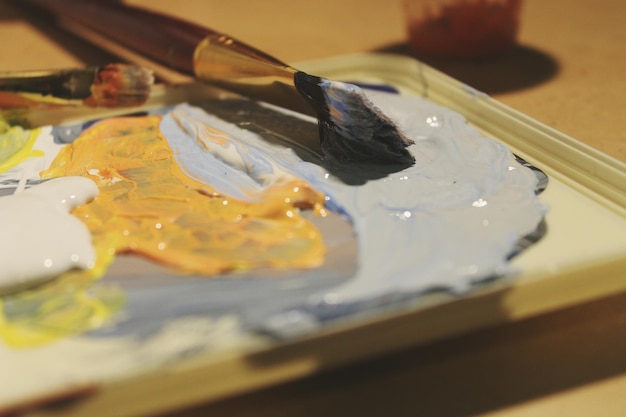 Close-up of paintbrush on palette