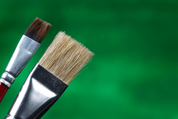 Close-up of paintbrushes against black background
