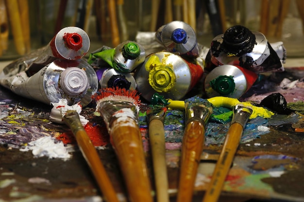 Close-up of paintbrushes and tubes