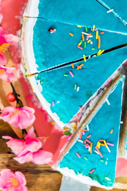 Close up of Pan cake with a cut piece and blade on tray