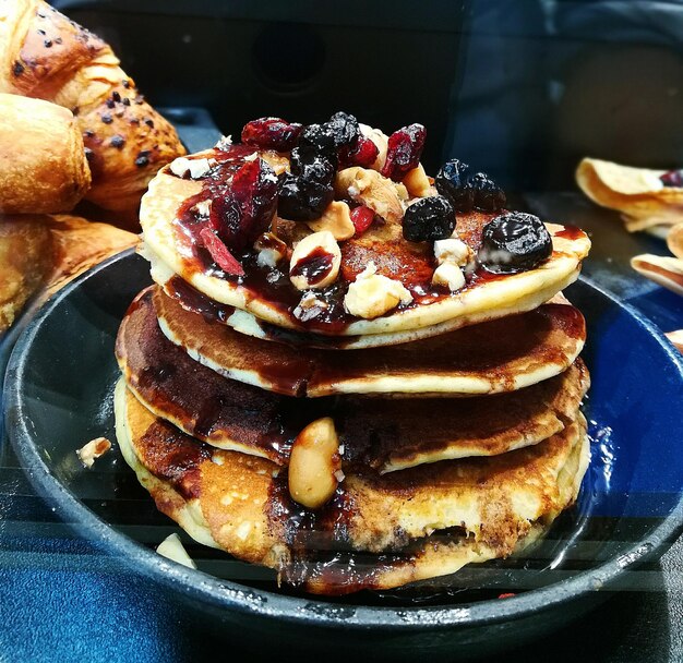 Close-up of pancakes in plate on table