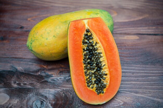 Close up papaya ripe on wooden backgroundstack photo