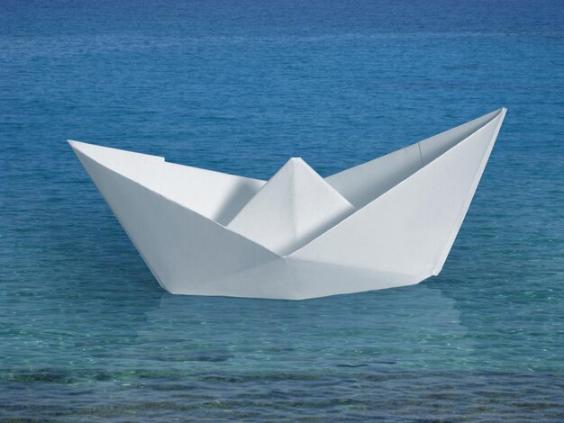 Close-up of paper boat in sea