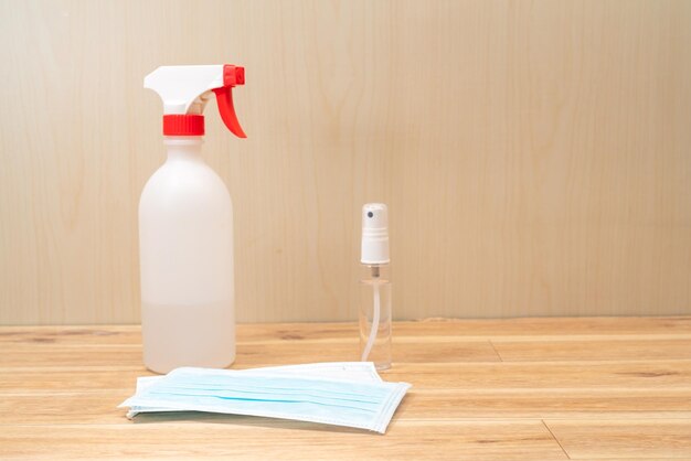 Close-up of paper bottle on table against wall at home