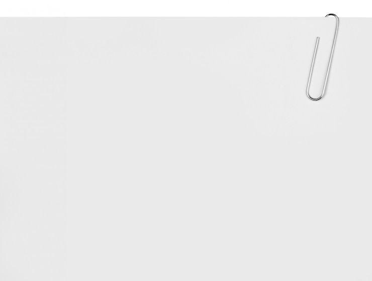 Photo close up of paper clip holding a blank paper sheet background