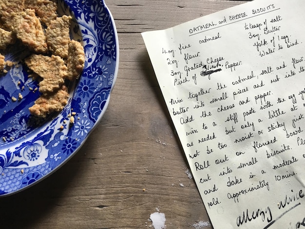 Close-up of paper and food on table