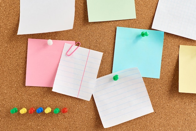 Close-up of papers on bulletin board