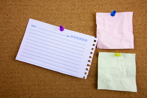 Photo close-up of papers on bulletin board