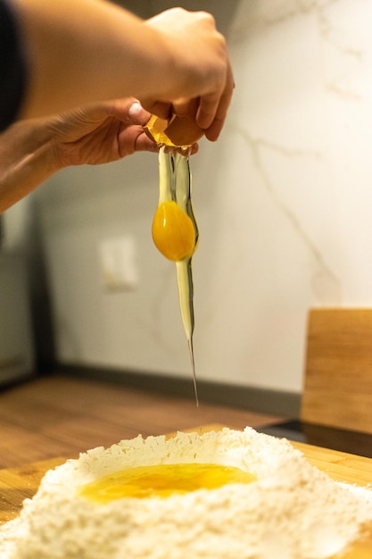 Close up of Pasta and Hands making home made Italian Pasta