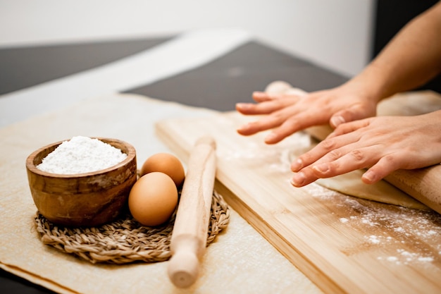 Close up of Pasta and Hands making home made Italian Pasta