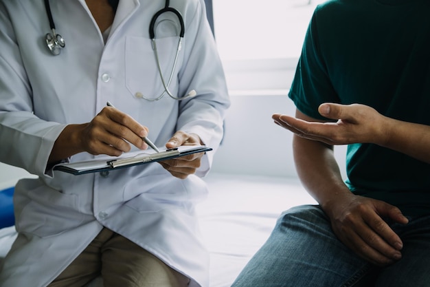 Close up of patient and doctor taking notes