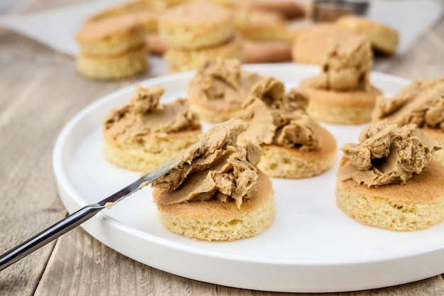 Close-up of peanut butter on breads over table