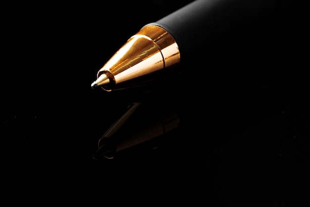 Close up of a pen on black background