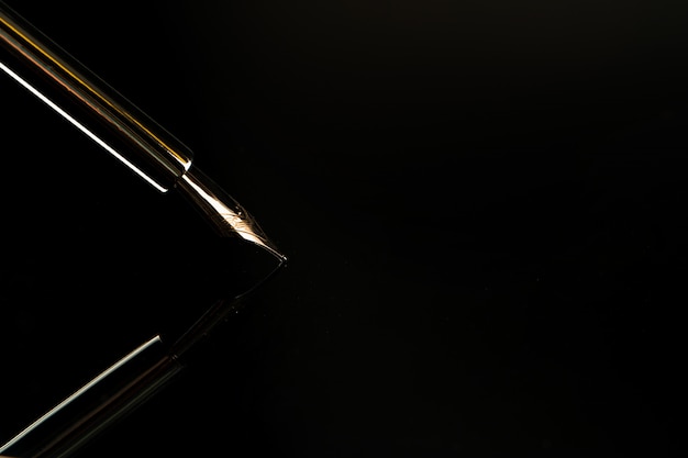 Close up of a pen on black background